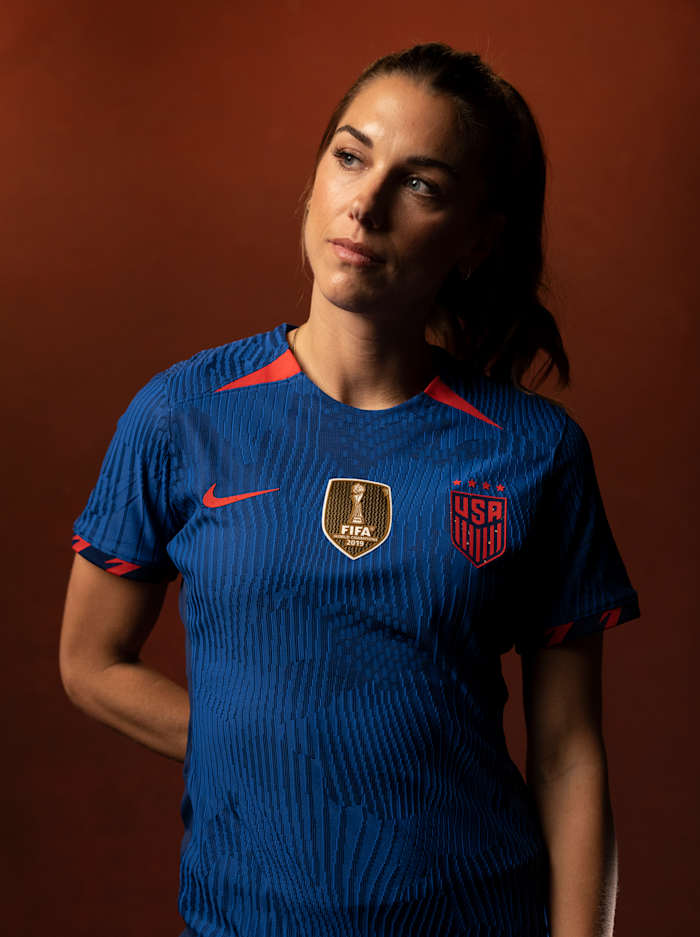 Closeup portrait of US women's national team forward Alex Morgan posing during a photo shoot.